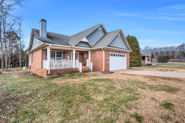 view of front of home featuring a garage, covered porch, and a front lawn