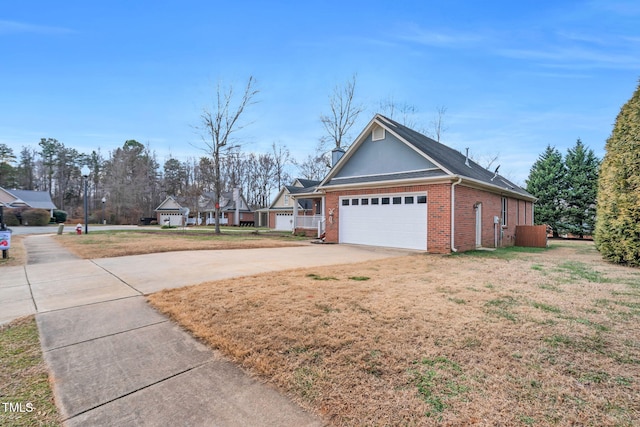 view of property exterior featuring a garage and a yard