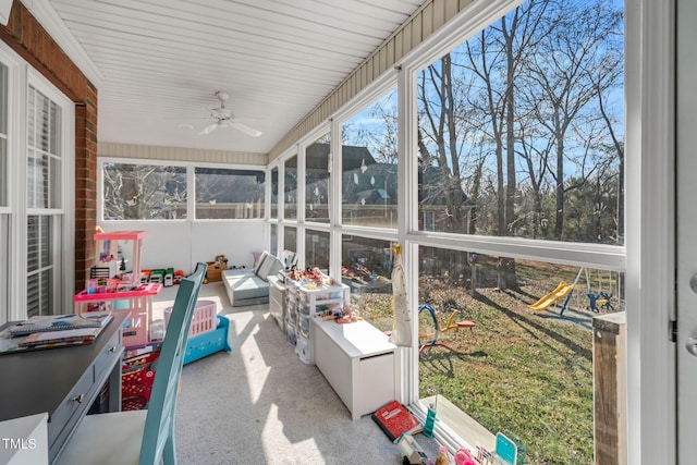 sunroom / solarium featuring ceiling fan and a healthy amount of sunlight