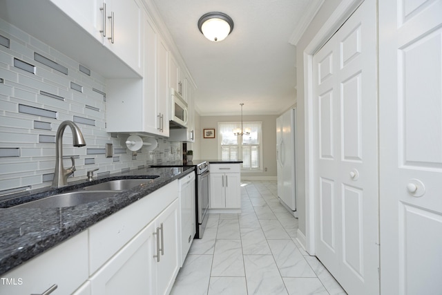 kitchen featuring white appliances, a sink, white cabinetry, crown molding, and marble finish floor