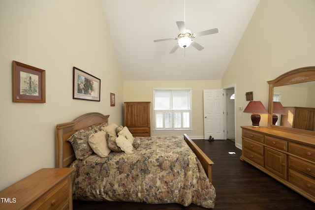 bedroom with a ceiling fan, baseboards, dark wood-type flooring, and high vaulted ceiling