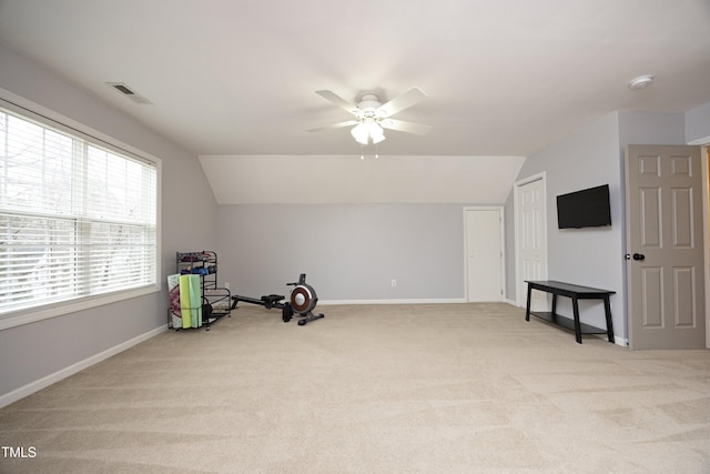 interior space featuring light carpet, lofted ceiling, and ceiling fan