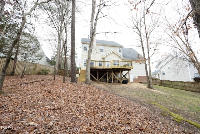 back of house with a deck