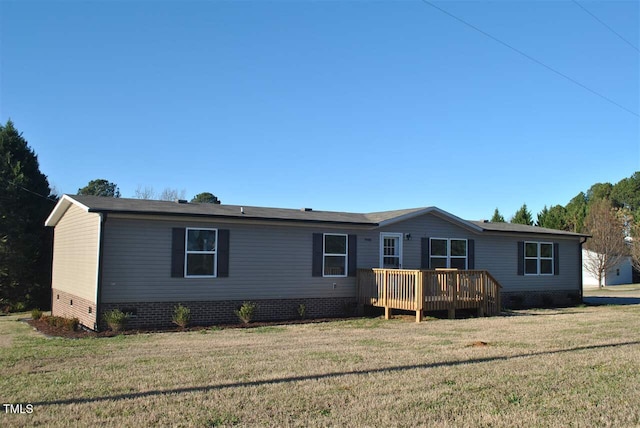 view of front of home featuring a front yard and a deck