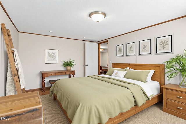 bedroom with baseboards and crown molding