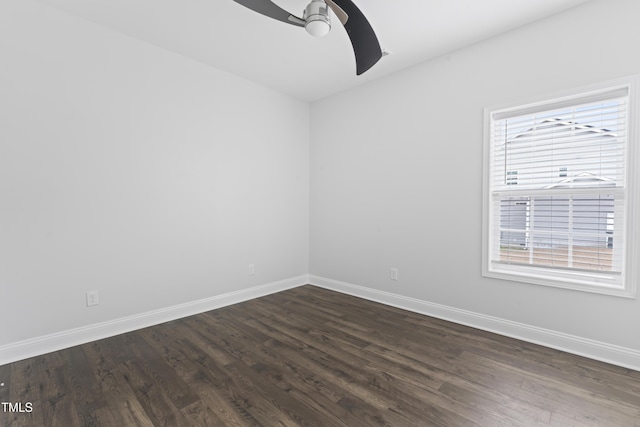 unfurnished room featuring dark wood-type flooring and ceiling fan