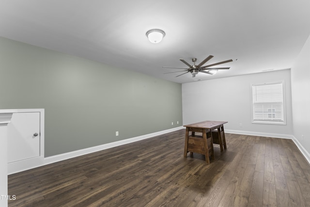 interior space featuring ceiling fan and dark hardwood / wood-style floors