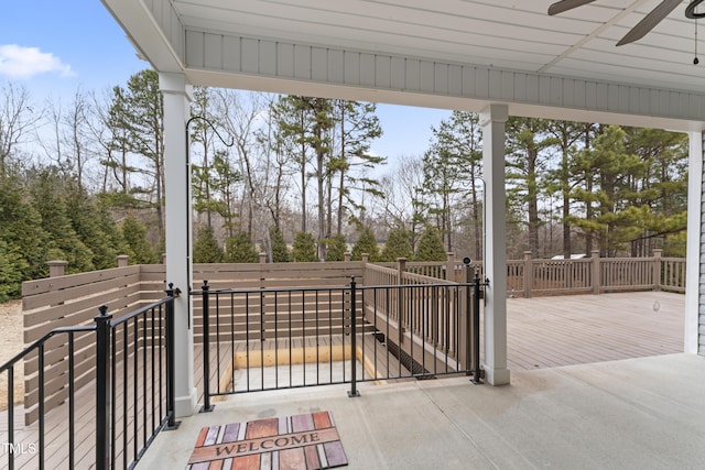 view of patio / terrace with a deck and ceiling fan