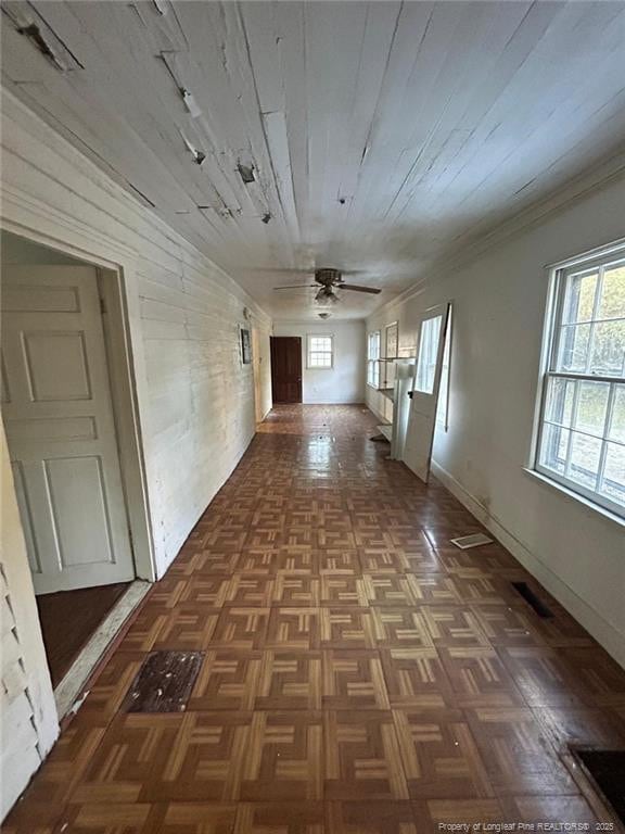 hallway with dark parquet flooring and wooden ceiling