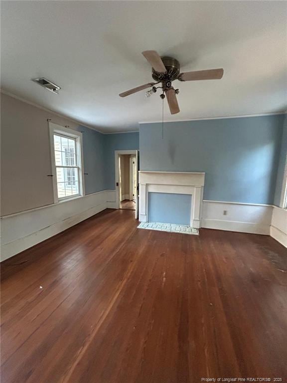 unfurnished living room with hardwood / wood-style flooring, ceiling fan, and ornamental molding