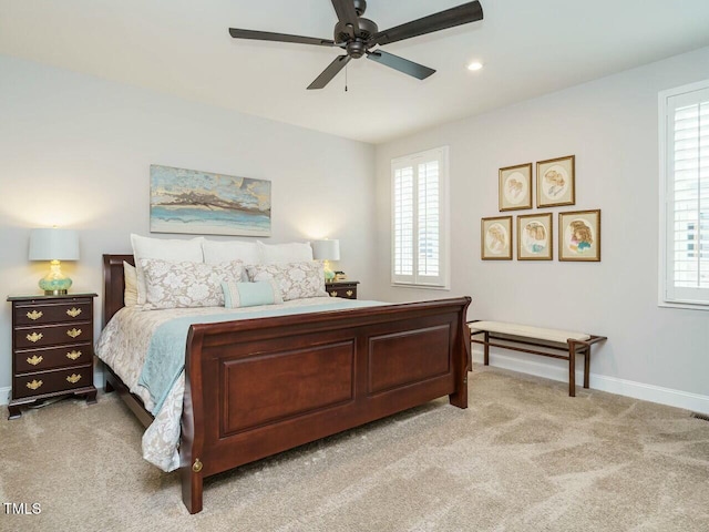 bedroom featuring light carpet and ceiling fan