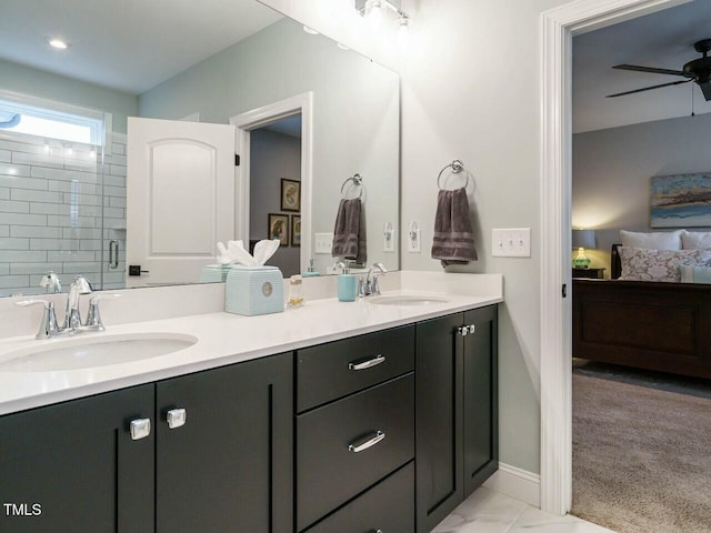 bathroom featuring vanity, ceiling fan, and walk in shower