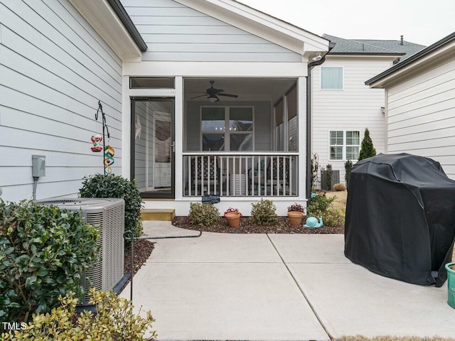 property entrance featuring cooling unit, a patio area, and ceiling fan