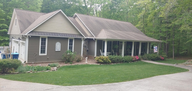 view of front of property with a garage and a front lawn