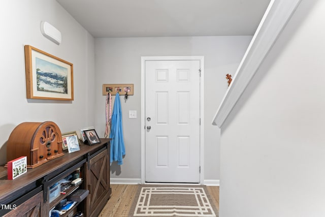 entryway with light hardwood / wood-style flooring