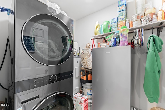 laundry room featuring stacked washing maching and dryer