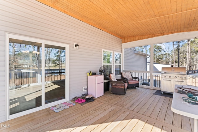 wooden deck with grilling area