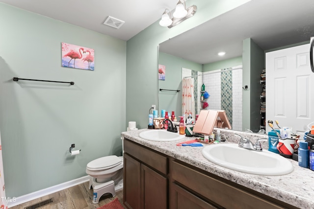 bathroom with a shower with curtain, vanity, toilet, and hardwood / wood-style flooring