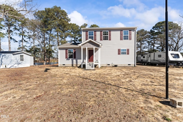 colonial inspired home featuring a front yard