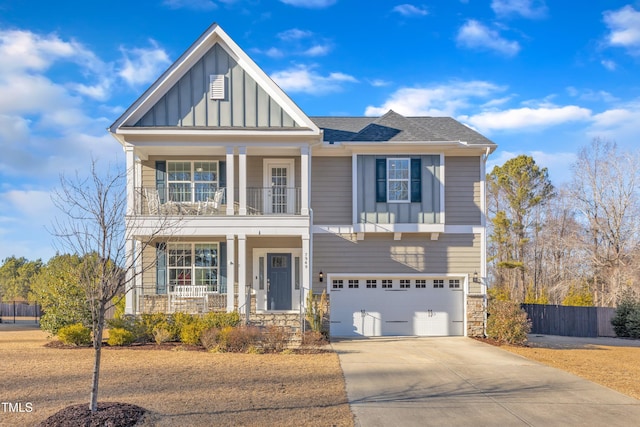 view of front of home featuring a garage and a balcony