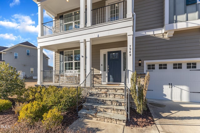 view of exterior entry featuring a porch