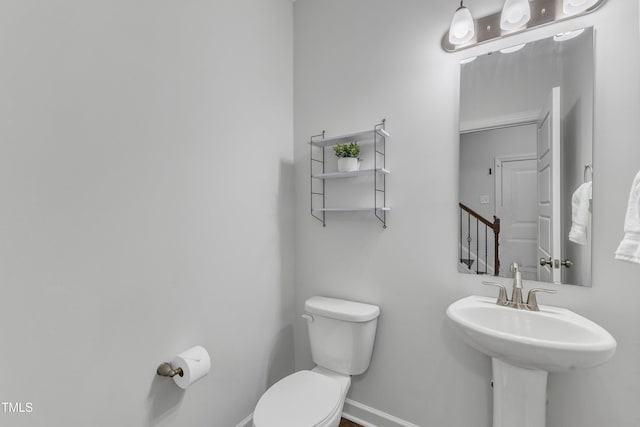 bathroom with toilet and sink