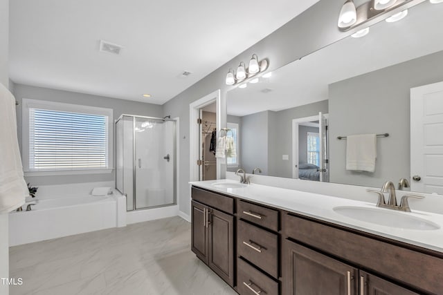 bathroom with vanity and separate shower and tub