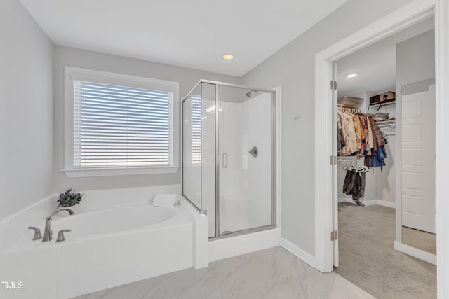 bathroom with separate shower and tub