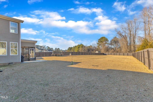 view of yard with a sunroom