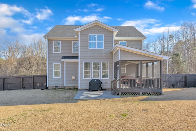 back of house with a wooden deck, a yard, a patio area, and a sunroom