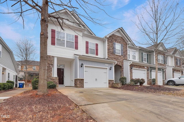 townhome / multi-family property featuring a garage