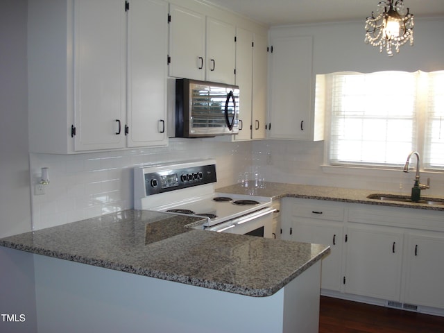 kitchen with white cabinetry, sink, range with electric cooktop, and stone counters