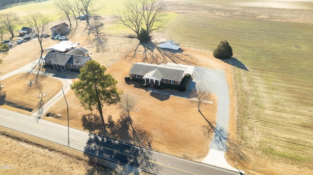 birds eye view of property featuring a rural view