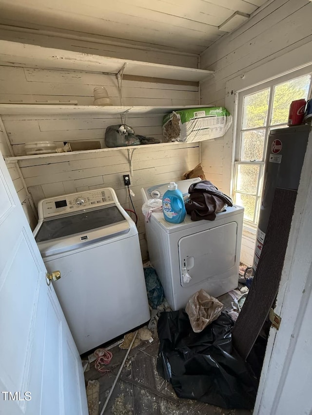 washroom with gas water heater and independent washer and dryer