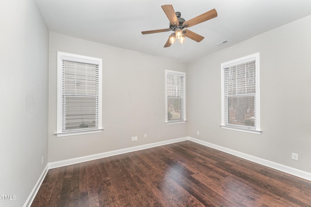 unfurnished room featuring dark hardwood / wood-style floors and ceiling fan