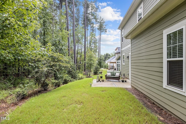 view of yard featuring outdoor lounge area and a patio area