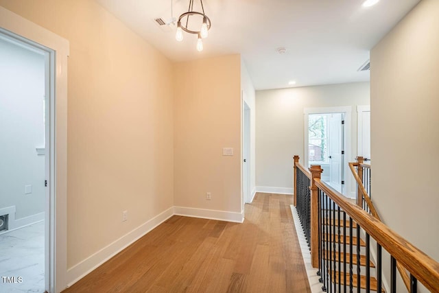corridor featuring light hardwood / wood-style flooring