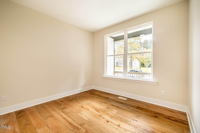 spare room featuring hardwood / wood-style flooring