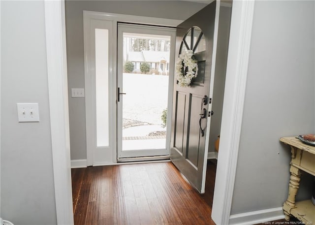 doorway with dark wood-type flooring