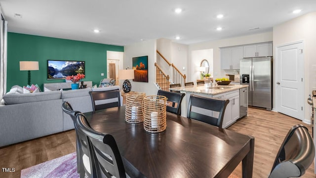 dining space featuring light hardwood / wood-style flooring