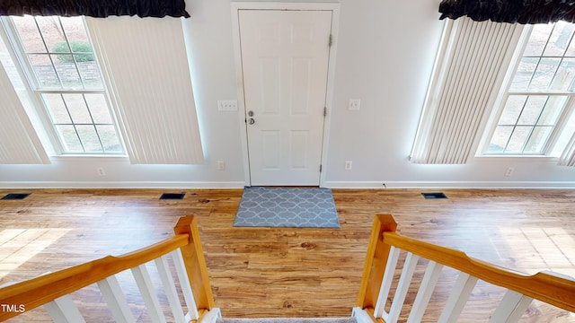 foyer entrance featuring hardwood / wood-style floors