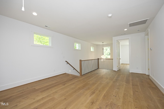 unfurnished room with light hardwood / wood-style floors