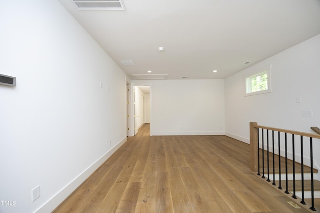 spare room featuring light wood-type flooring