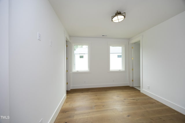 unfurnished room with light hardwood / wood-style flooring