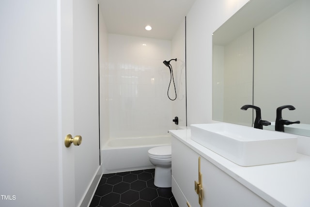 full bathroom featuring tile patterned floors, toilet, bathing tub / shower combination, and vanity