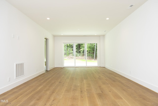 spare room with light wood-type flooring