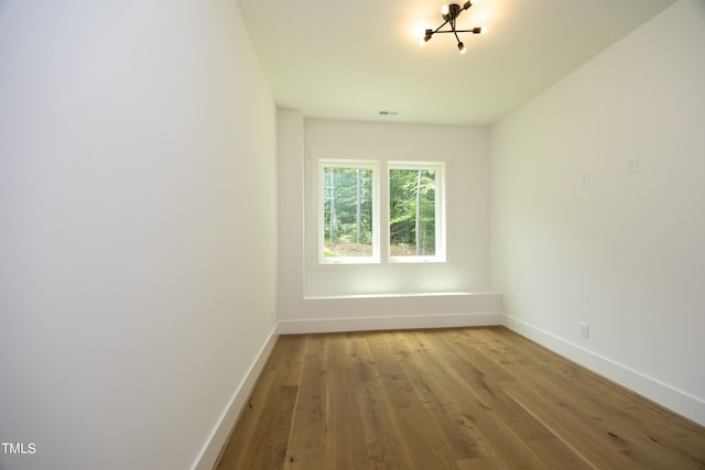 spare room with light wood-type flooring