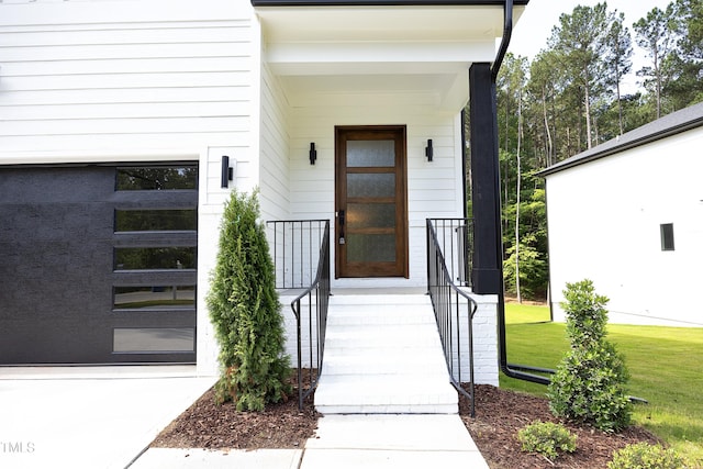 doorway to property with a lawn