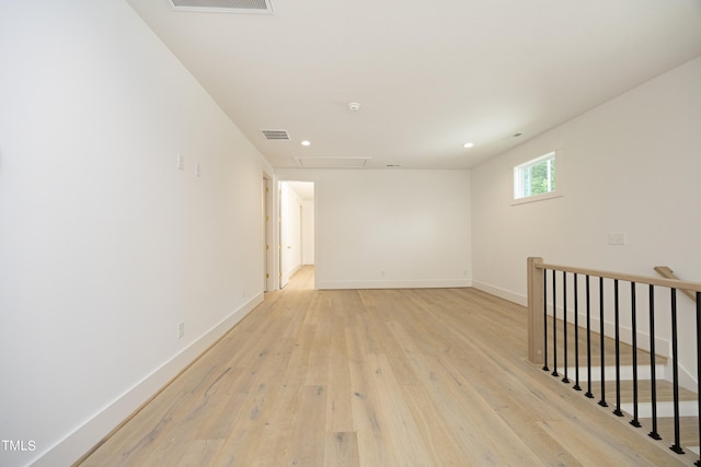 unfurnished room with light wood-type flooring