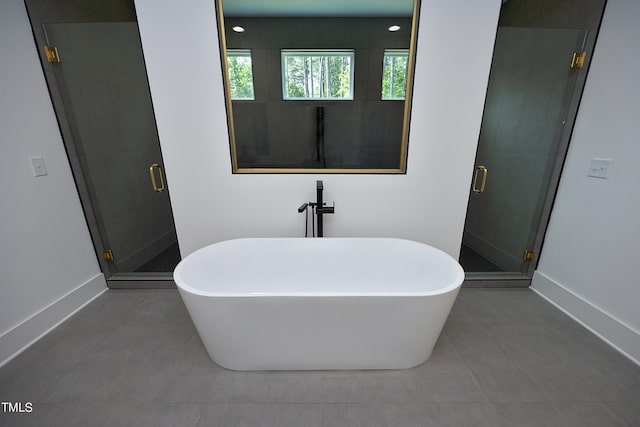 bathroom with tile patterned flooring and plus walk in shower